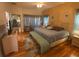 Bright bedroom with king-size bed and views to the backyard at 24502 Parlange Ct, Leesburg, FL 34748
