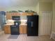 Kitchen boasts granite countertops and ample cabinetry at 24502 Parlange Ct, Leesburg, FL 34748