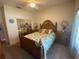 Guest bedroom with full-size bed and mirrored closet doors at 24502 Parlange Ct, Leesburg, FL 34748