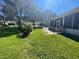 Backyard patio with seating area and lush landscaping at 24502 Parlange Ct, Leesburg, FL 34748