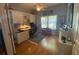 Bright home office features built-in shelving and wood flooring at 24502 Parlange Ct, Leesburg, FL 34748