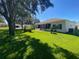 Expansive backyard showcasing a large lawn area at 24502 Parlange Ct, Leesburg, FL 34748