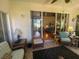 Sunroom with seating area, offering views of the backyard at 24502 Parlange Ct, Leesburg, FL 34748