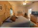 Large bedroom with king-size bed, ensuite bathroom access, and walk-in closet at 24502 Parlange Ct, Leesburg, FL 34748