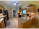 Kitchen boasts granite countertops and ample cabinetry at 24502 Parlange Ct, Leesburg, FL 34748
