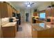 Kitchen boasts granite countertops and ample cabinetry at 24502 Parlange Ct, Leesburg, FL 34748