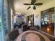 Relaxing sunroom with seating area, ceiling fan and access to backyard at 24502 Parlange Ct, Leesburg, FL 34748