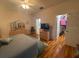 Main bedroom with king-size bed and walk-in closet at 24502 Parlange Ct, Leesburg, FL 34748
