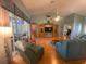 Spacious living room with hardwood floors and large windows at 24502 Parlange Ct, Leesburg, FL 34748