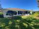 Spacious backyard with patio and lush lawn at 24502 Parlange Ct, Leesburg, FL 34748