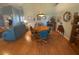 Bright dining room with wood flooring and a round dining table at 24502 Parlange Ct, Leesburg, FL 34748