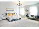 Relaxing primary bedroom with plush bedding and sitting area at 29912 Cypress Pointe, Deer Island, FL 32778