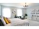 Bright and airy bedroom with ample natural light and seating area at 29912 Cypress Pointe, Deer Island, FL 32778
