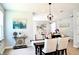 Elegant dining room featuring a rustic wooden table with seating for six at 29912 Cypress Pointe, Deer Island, FL 32778