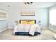 Large main bedroom with plush bed, sitting area and plenty of natural light at 29912 Cypress Pointe, Deer Island, FL 32778