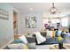 Open concept living room with views into the kitchen area at 29912 Cypress Pointe, Deer Island, FL 32778