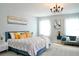 Spacious primary bedroom with plush carpeting and a sitting area at 29912 Cypress Pointe, Deer Island, FL 32778
