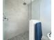 Walk-in shower with pebble floor and modern fixtures at 29912 Cypress Pointe, Deer Island, FL 32778