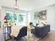 Living room with large sliding glass doors opening to backyard at 29912 Cypress Pointe, Deer Island, FL 32778