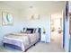 Guest bedroom with a serene atmosphere and access to hallway at 29912 Cypress Pointe, Deer Island, FL 32778