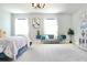 Luxurious main bedroom featuring a comfortable bed, sitting area, and plenty of natural light at 29912 Cypress Pointe, Deer Island, FL 32778