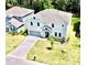 Aerial view of house, driveway and yard at 29912 Cypress Pointe, Deer Island, FL 32778