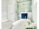 Spa-like bathroom featuring a soaking tub and a large walk-in shower at 29912 Cypress Pointe, Deer Island, FL 32778