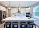 Spacious kitchen boasts white cabinets, an island with seating, and stainless steel appliances at 29912 Cypress Pointe, Deer Island, FL 32778