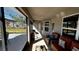 Relaxing screened porch with comfortable seating and backyard views at 9832 Sw 46Th Ct, Ocala, FL 34476