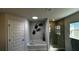 Bathroom with a soaking tub, walk-in shower, and modern vanity at 9832 Sw 46Th Ct, Ocala, FL 34476