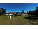 View of the backyard with a gazebo and a large grassy area at 9832 Sw 46Th Ct, Ocala, FL 34476