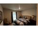 Cozy bedroom with a queen-size bed and window at 9832 Sw 46Th Ct, Ocala, FL 34476