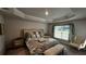 Bedroom with king-size bed and stylish decor at 9832 Sw 46Th Ct, Ocala, FL 34476