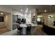 Modern kitchen boasting gray cabinets, granite countertops, and stainless steel appliances at 9832 Sw 46Th Ct, Ocala, FL 34476