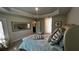Second bedroom with a queen-size bed and access to the bathroom at 9832 Sw 46Th Ct, Ocala, FL 34476