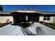 Back patio features a table and chairs under an umbrella at 9832 Sw 46Th Ct, Ocala, FL 34476