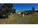 Large backyard with covered patio, spacious grassy area, and a gazebo at 9832 Sw 46Th Ct, Ocala, FL 34476