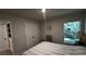 Spacious bedroom with a queen-size bed and window at 9832 Sw 46Th Ct, Ocala, FL 34476