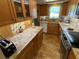 Kitchen with granite countertops and wood cabinets at 601 N Mcdonald St # 208, Mount Dora, FL 32757