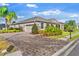 House exterior showcasing landscaping and paver driveway at 1532 Eagle Ridge Dr, Lakeland, FL 33813