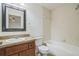 Bathroom features a tub, shower, and updated vanity at 4755 Nw 61St Ave, Ocala, FL 34482