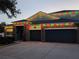 Two story house with three car garage and festive lights at 348 Magneta Loop, Auburndale, FL 33823