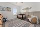 Bright Bedroom with crib, chair, and playful decor at 1548 Astoria Arbor Ln, Orlando, FL 32824