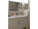 Clean bathroom with white vanity and large mirror at 4005 Santa Maria Dr # 103, Kissimmee, FL 34741