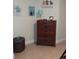Spacious bedroom with wood dresser and themed decor at 4005 Santa Maria Dr # 103, Kissimmee, FL 34741