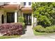 Inviting front entrance with double doors, lush landscaping, and brick walkway at 1250 S Pennsylvania Ave # 8, Winter Park, FL 32789