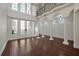 Spacious living room with hardwood floors, high ceilings, and French doors at 1250 S Pennsylvania Ave # 8, Winter Park, FL 32789