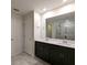 Double vanity bathroom with large mirror and dark cabinets at 2905 Black Birch Dr, Ocoee, FL 34761
