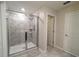 Walk-in shower with glass enclosure and tiled walls at 2905 Black Birch Dr, Ocoee, FL 34761