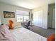 Bedroom with daybed, desk and closet at 2905 Black Birch Dr, Ocoee, FL 34761